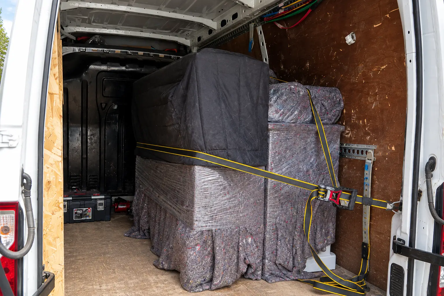 House removal furniture secured inside moving van